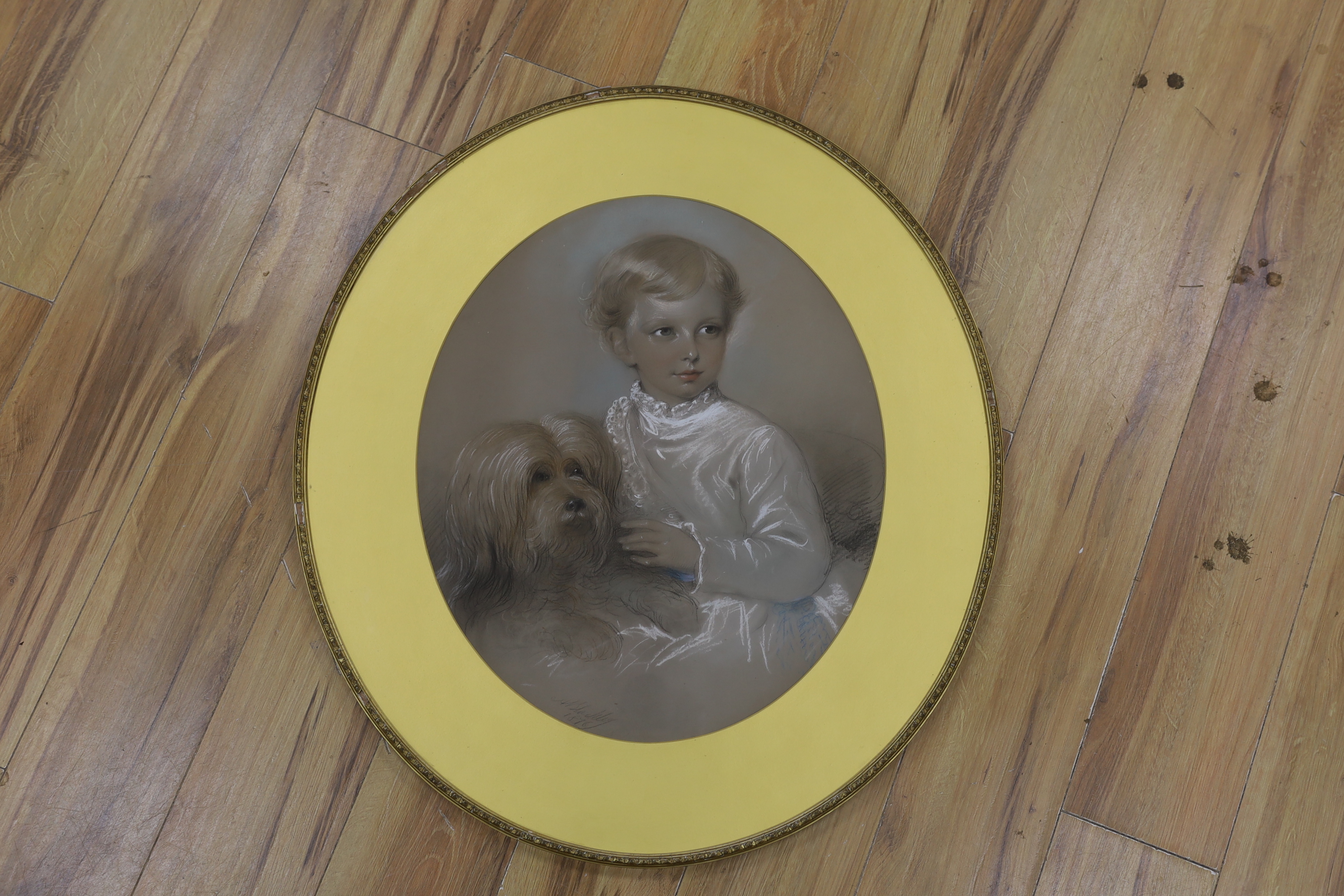 19th century English School, pastel drawing, Family portrait of child and dog, oval, indistinctly signed and dated 1876, 54 x 45cm, Thomas Agnew label verso